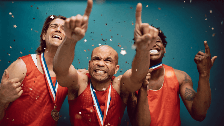 Three men celebrating a recent win